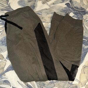 Garage green / grey sweatpants with cut out netting